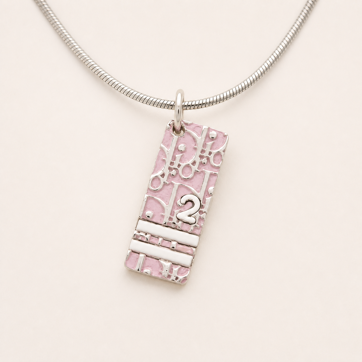 Christian Dior pink Trotter pendant necklace on silver-tone chain