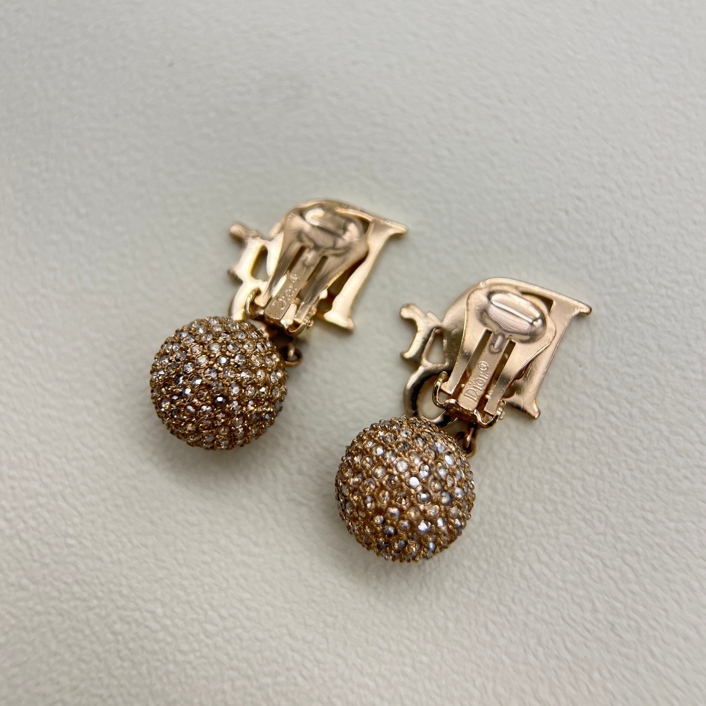 Christian Dior Vintage Dior Logo and Ball Dangling with Rhinestone Golden Clip-on Earrings
