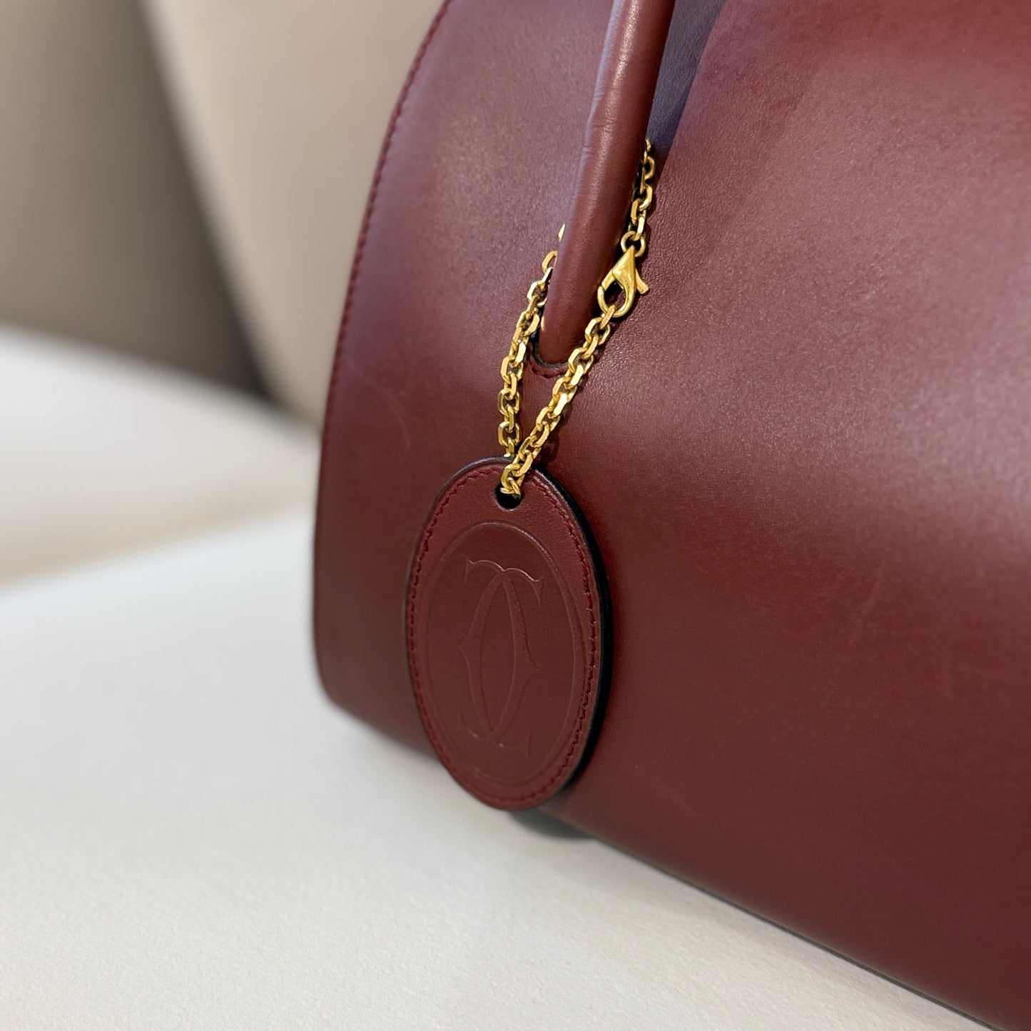 Cartier Must Line Burgundy Red Leather Boston Bag With Golden Chain Logo Charm