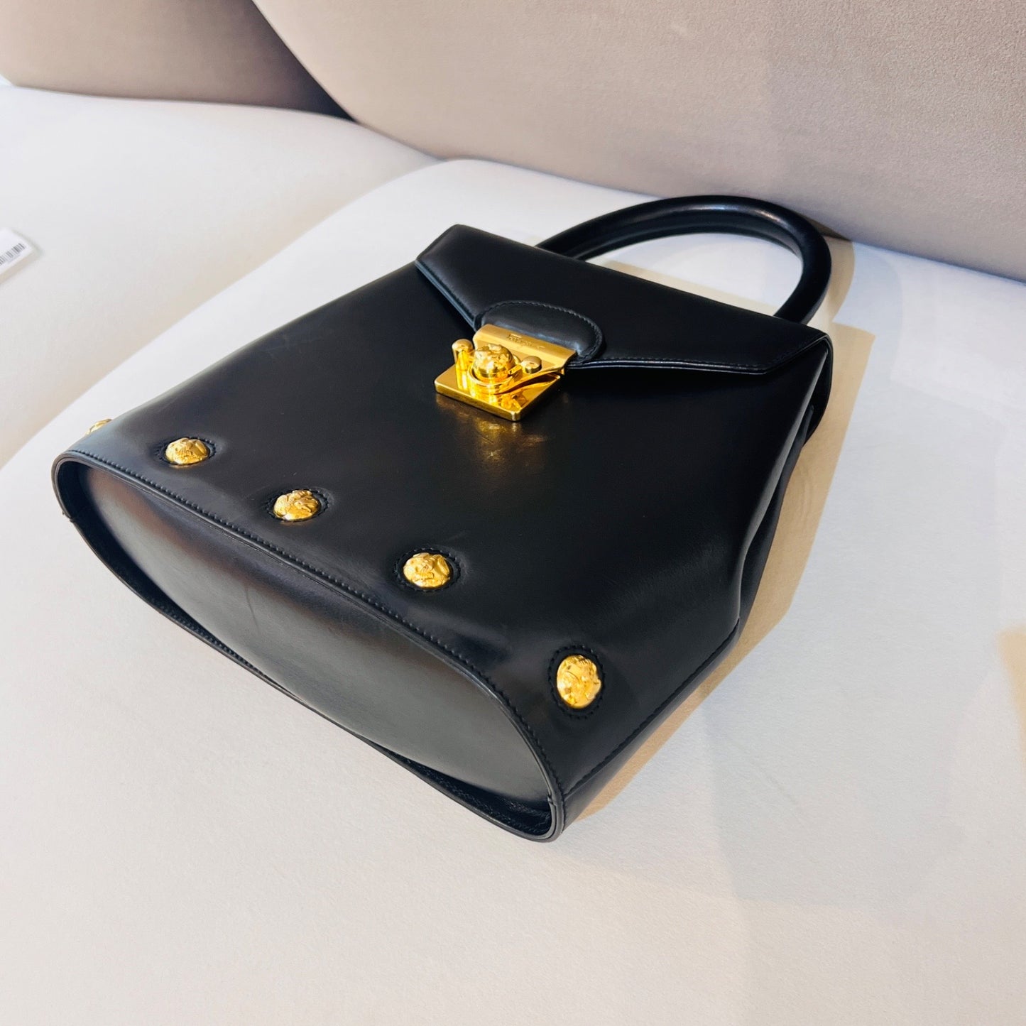 Ferragamo Vintage Black Leather 2-Way Handbag With Gold Medallions