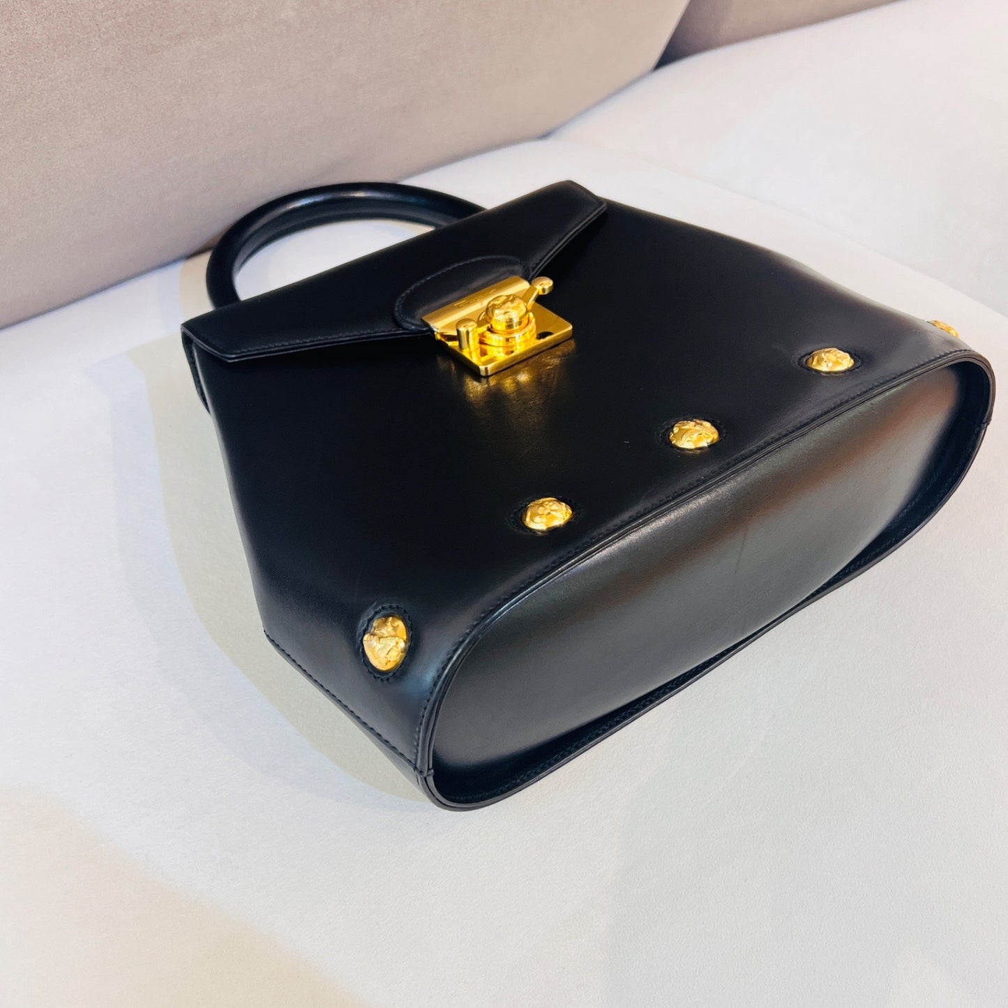 Ferragamo Vintage Black Leather 2-Way Handbag With Gold Medallions