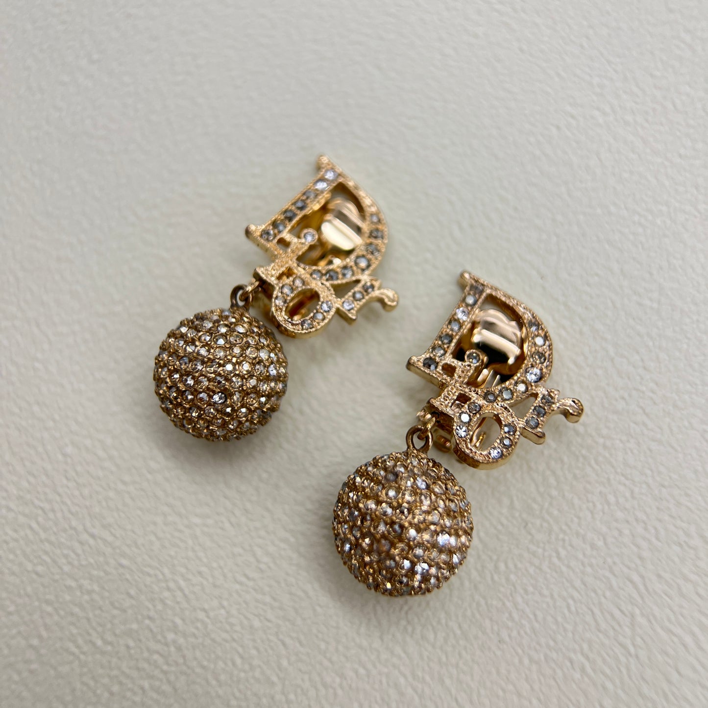 Christian Dior Vintage Dior Logo and Ball Dangling with Rhinestone Golden Clip-on Earrings