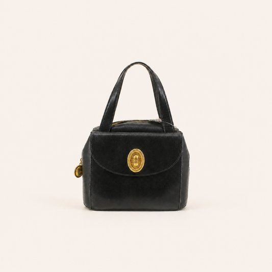 Christian Dior vintage black leather box handbag with oval gold-tone turn-lock, front view