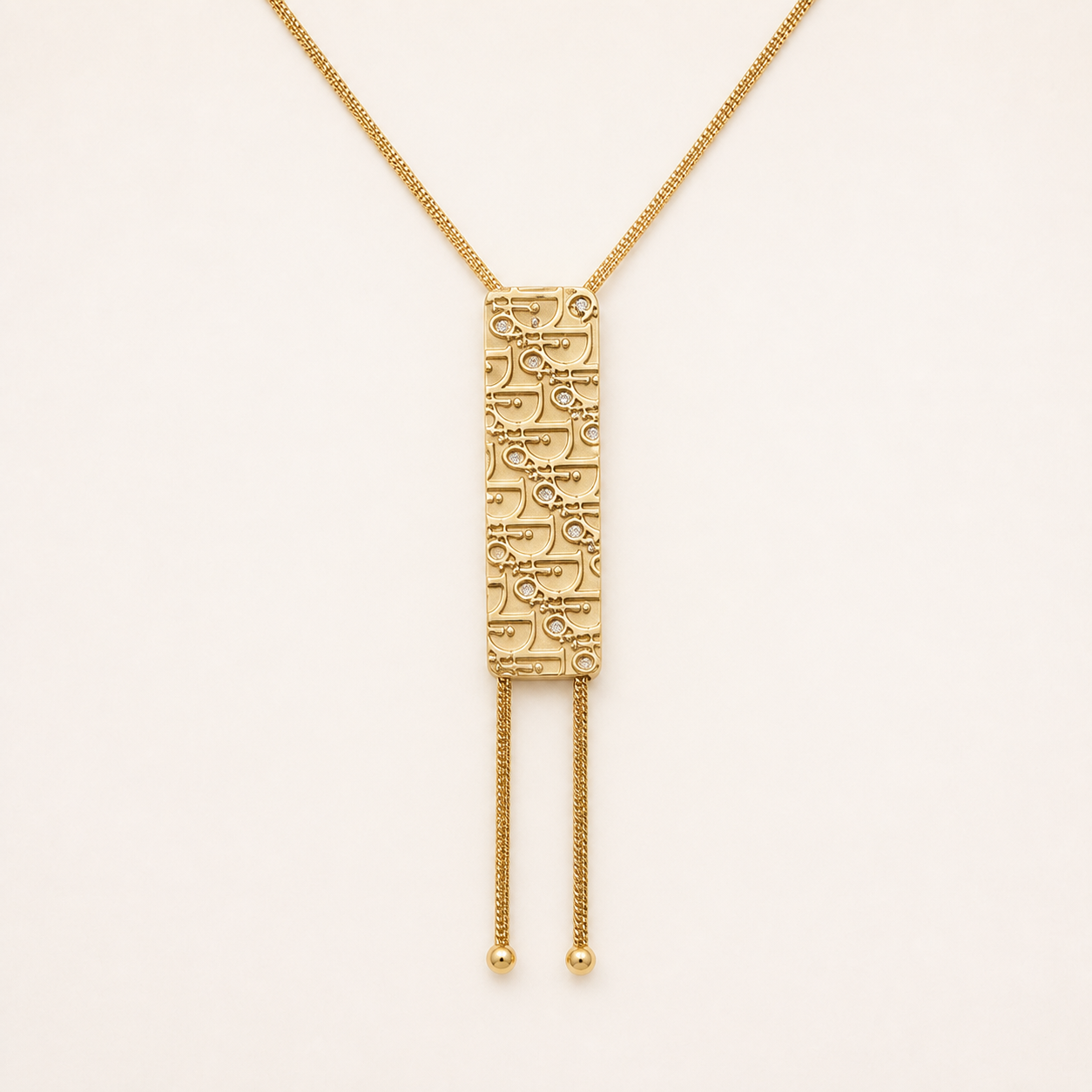 Christian Dior Trotter plaque tassel necklace in gold-tone metal