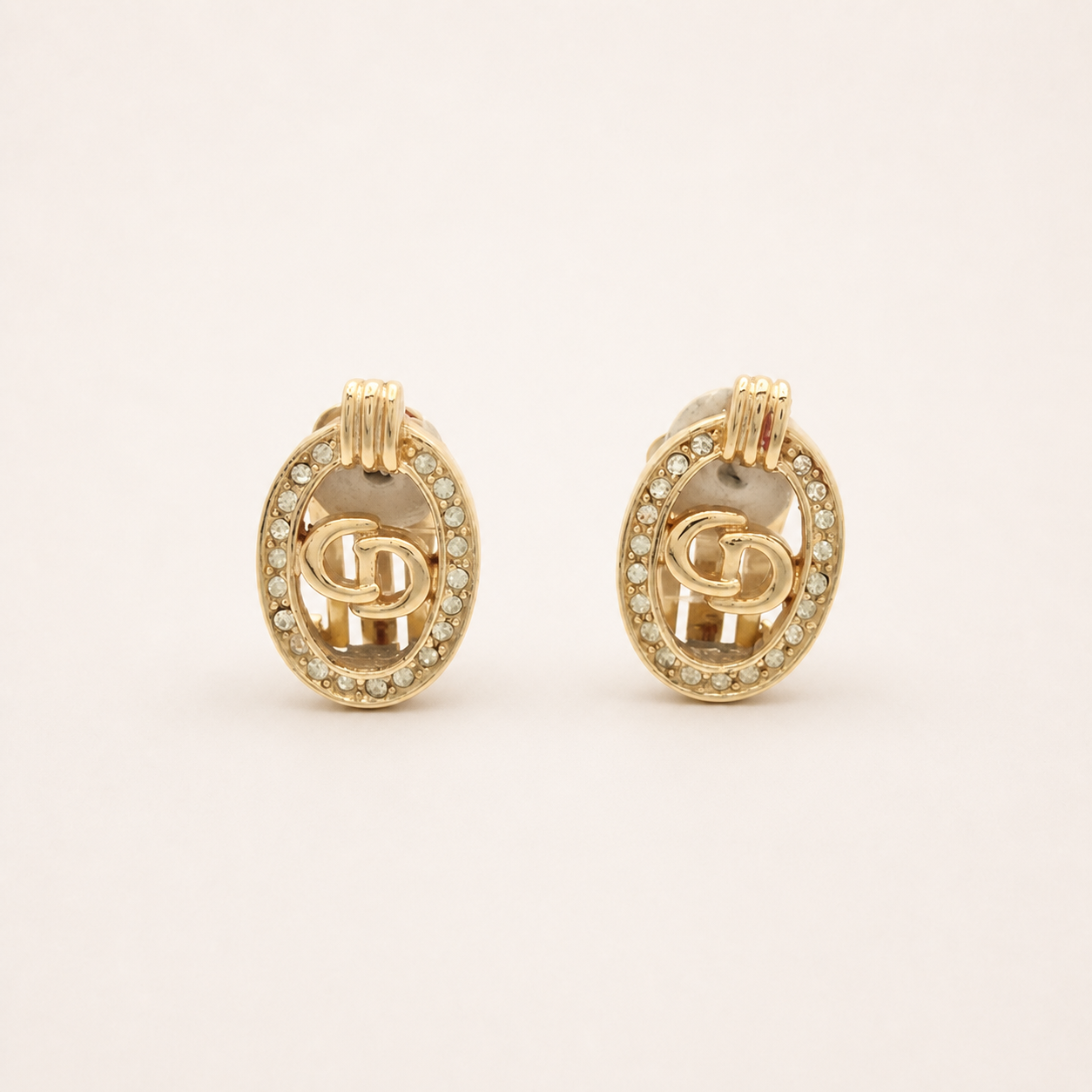 Christian Dior oval rhinestone CD clip earrings in gold-tone metal