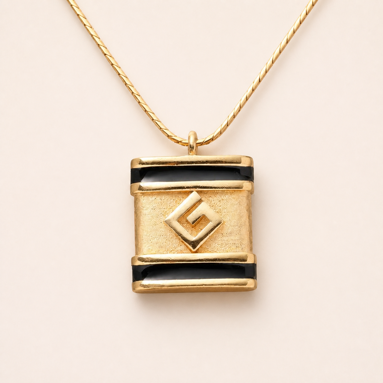 Givenchy black enamel G pendant necklace in gold-tone metal