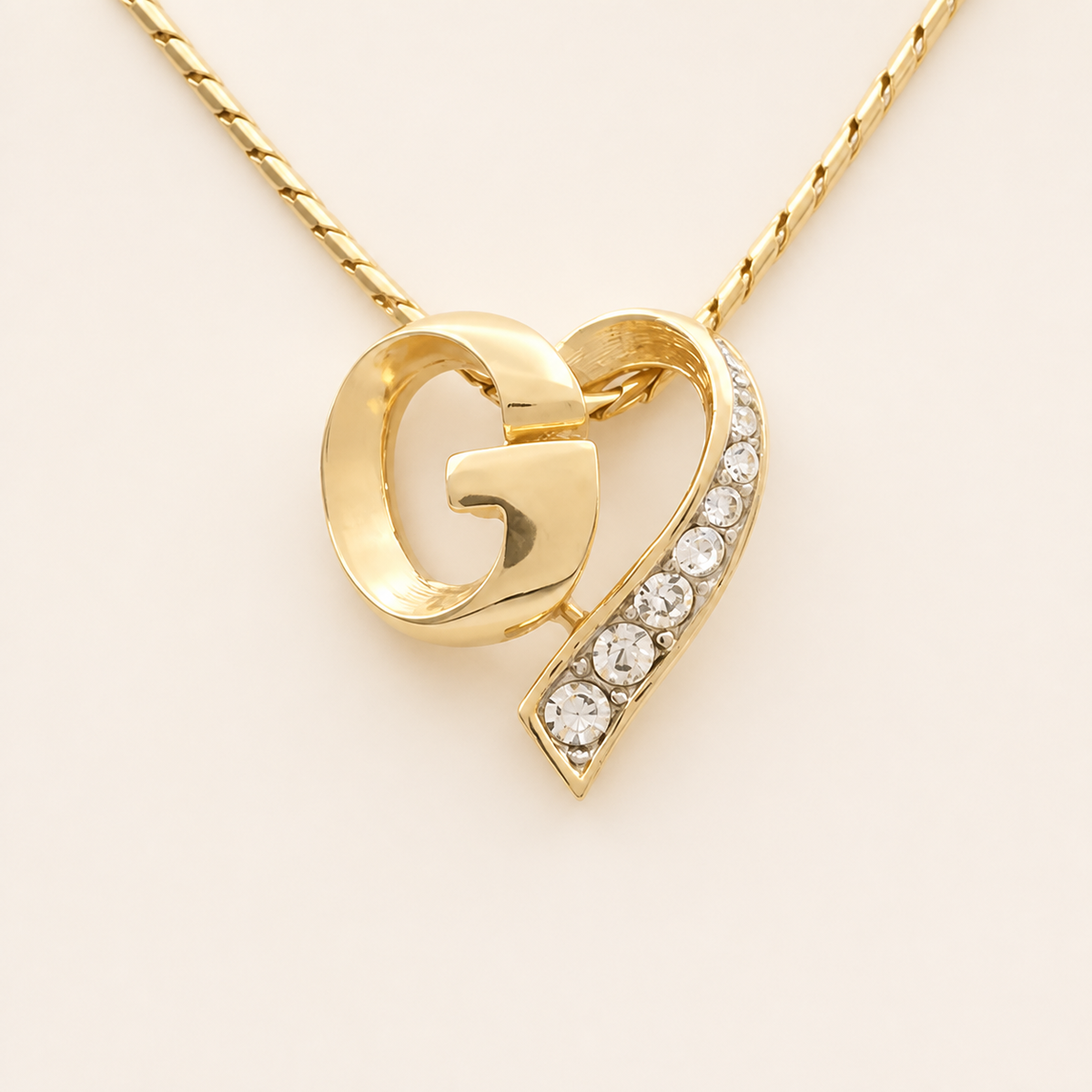 Givenchy crystal G heart necklace in gold-tone metal