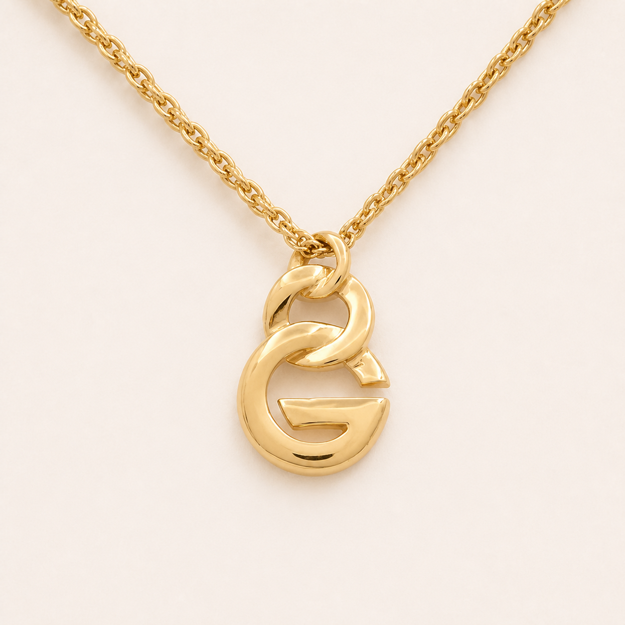 Givenchy sculpted G pendant necklace in gold-tone metal