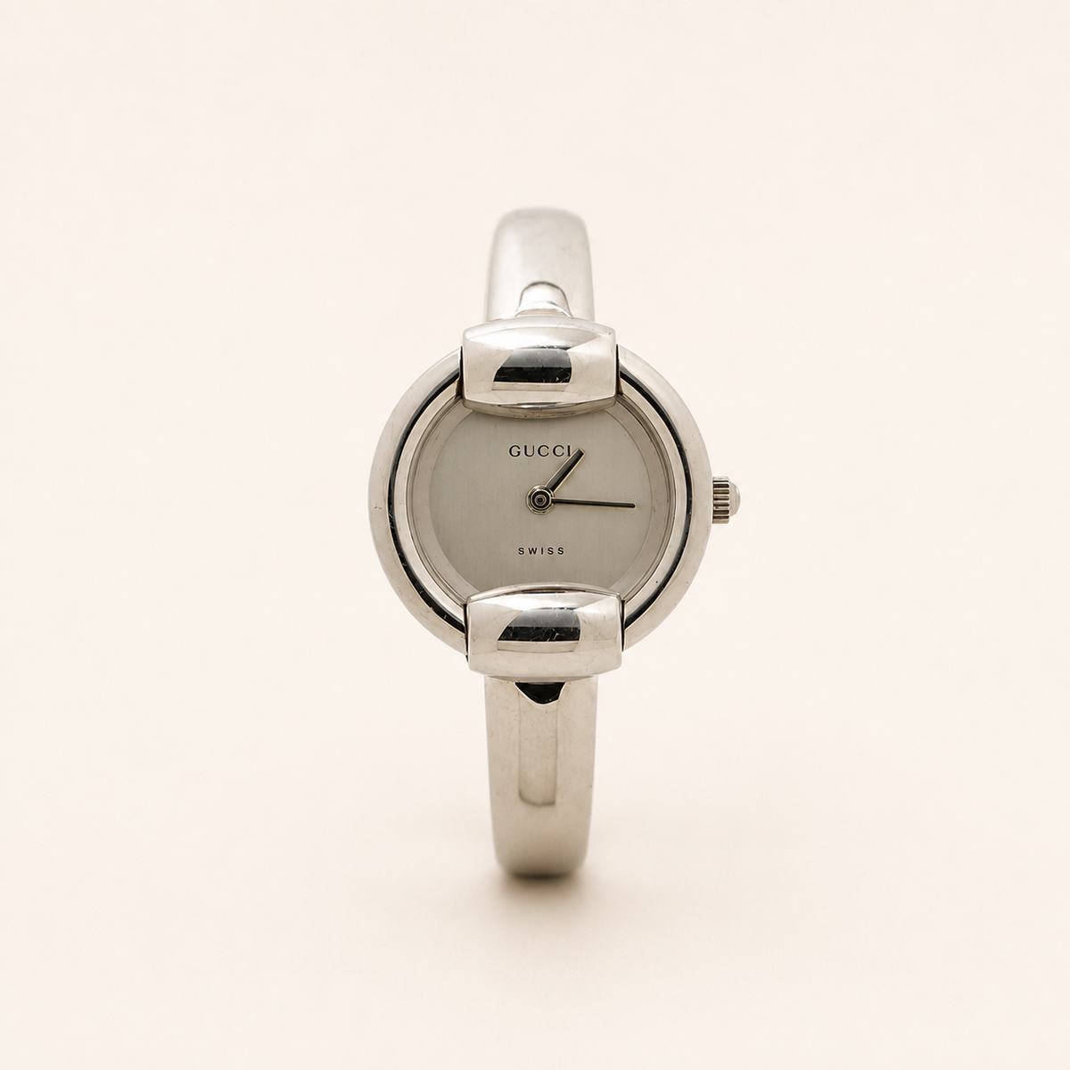 Gucci vintage 1400L silver stainless steel white dial bangle watch, front view