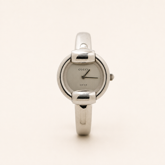Gucci vintage 1400L silver stainless steel white dial bangle watch, front view