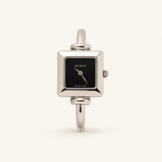 Gucci vintage 1900L silver stainless steel black square dial bangle watch, front view