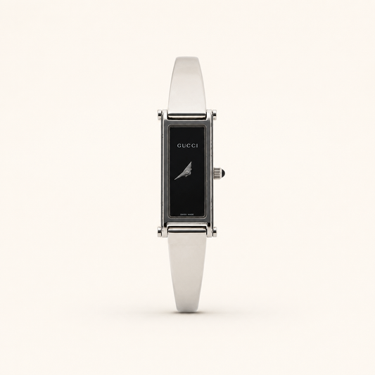 Gucci vintage 1500L silver stainless steel black dial bangle watch, front view