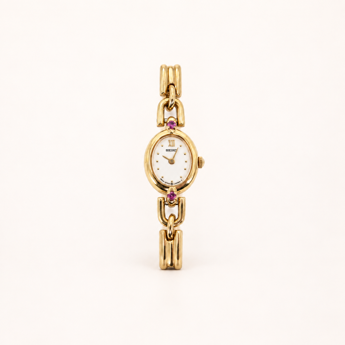 Seiko Vintage Oval Dial Amethyst Stone Bone Link Golden Watch – Diorella vintage product cover