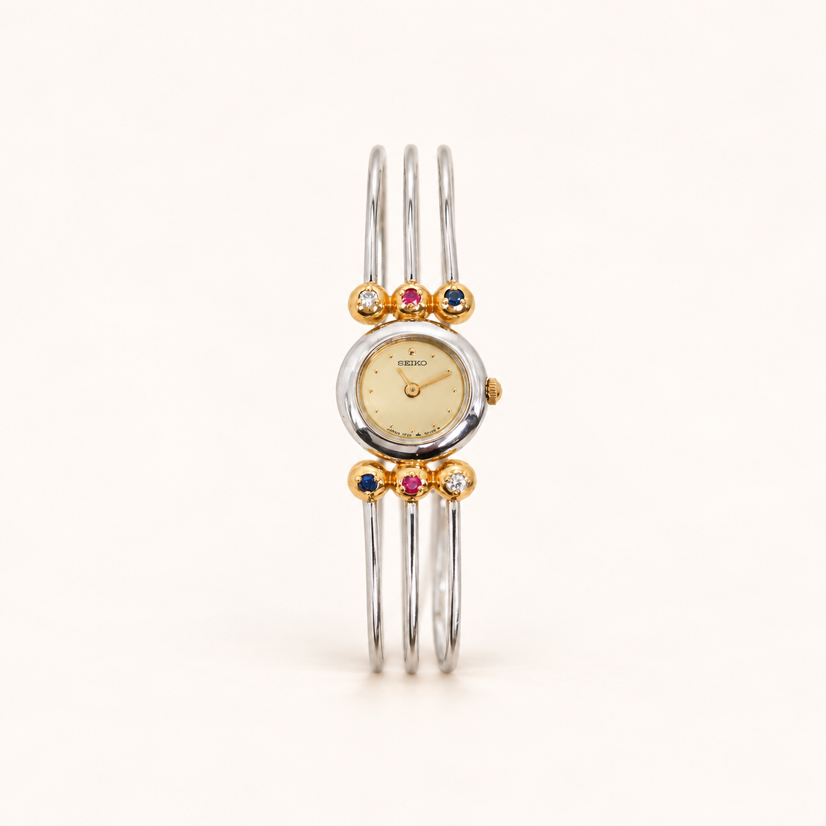 Seiko Vintage Round Face and Multi Gems Accents Tri-Wire Bangle Watch – Diorella vintage product cover