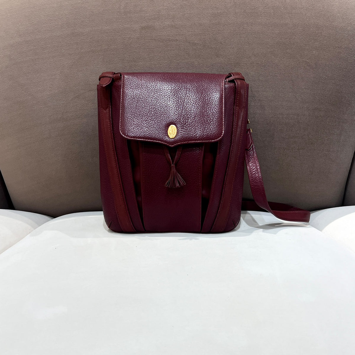 Cartier Burgundy Flap Backpack with Tassel Detail — front