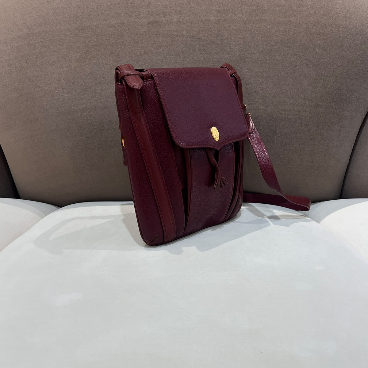 Cartier Burgundy Flap Backpack with Tassel Detail — side angle