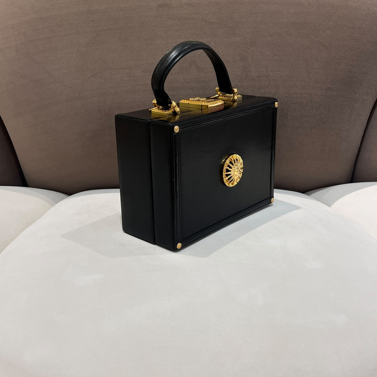 Versace Black Vanity Box Handbag with Gold-Tone Sunburst — side angle
