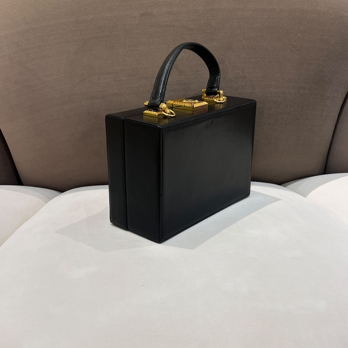 Versace Black Vanity Box Handbag with Gold-Tone Sunburst — opposite side angle