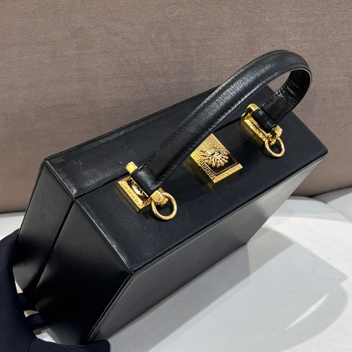 Versace Black Vanity Box Handbag with Gold-Tone Sunburst — top handle and hardware