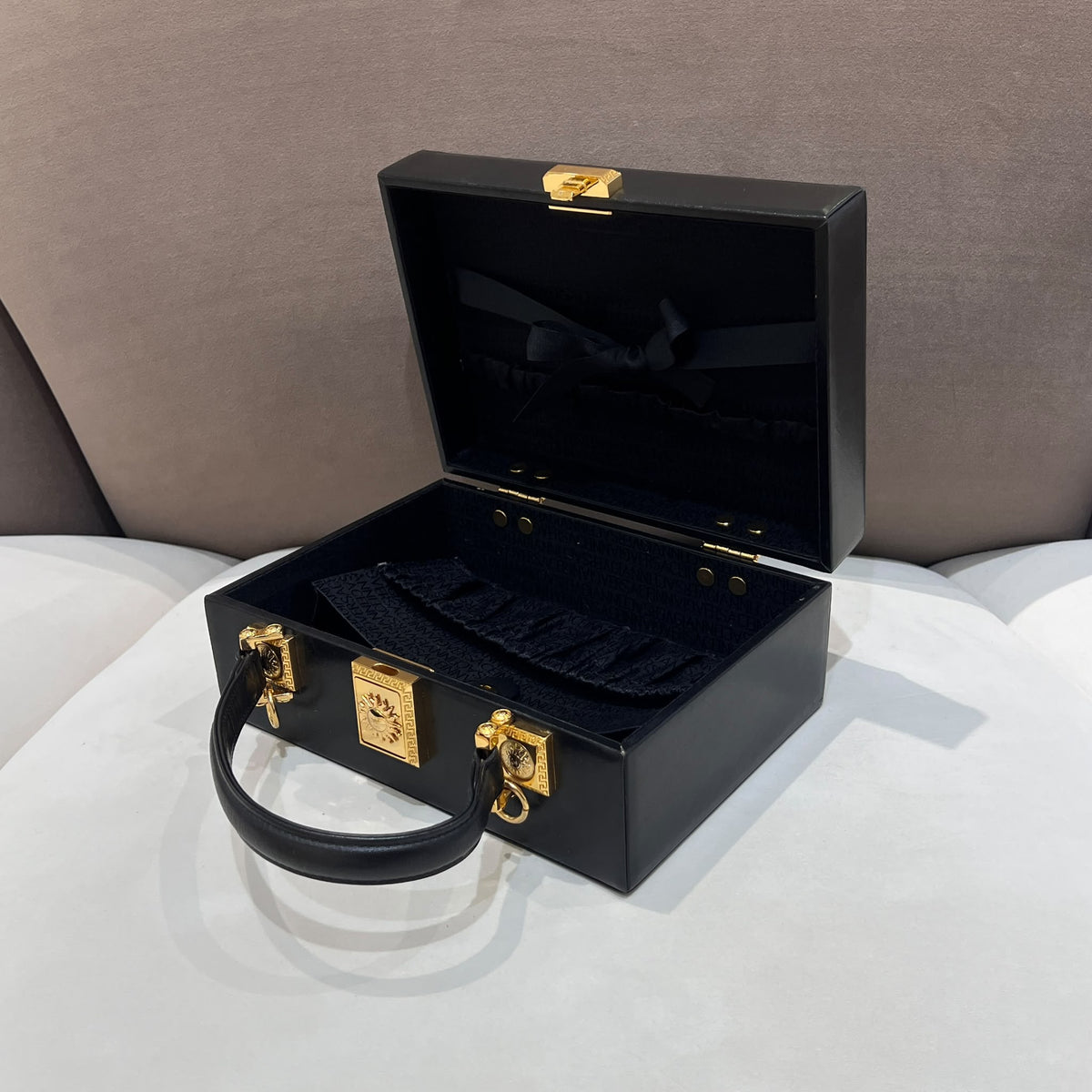 Versace Black Vanity Box Handbag with Gold-Tone Sunburst — open case side angle