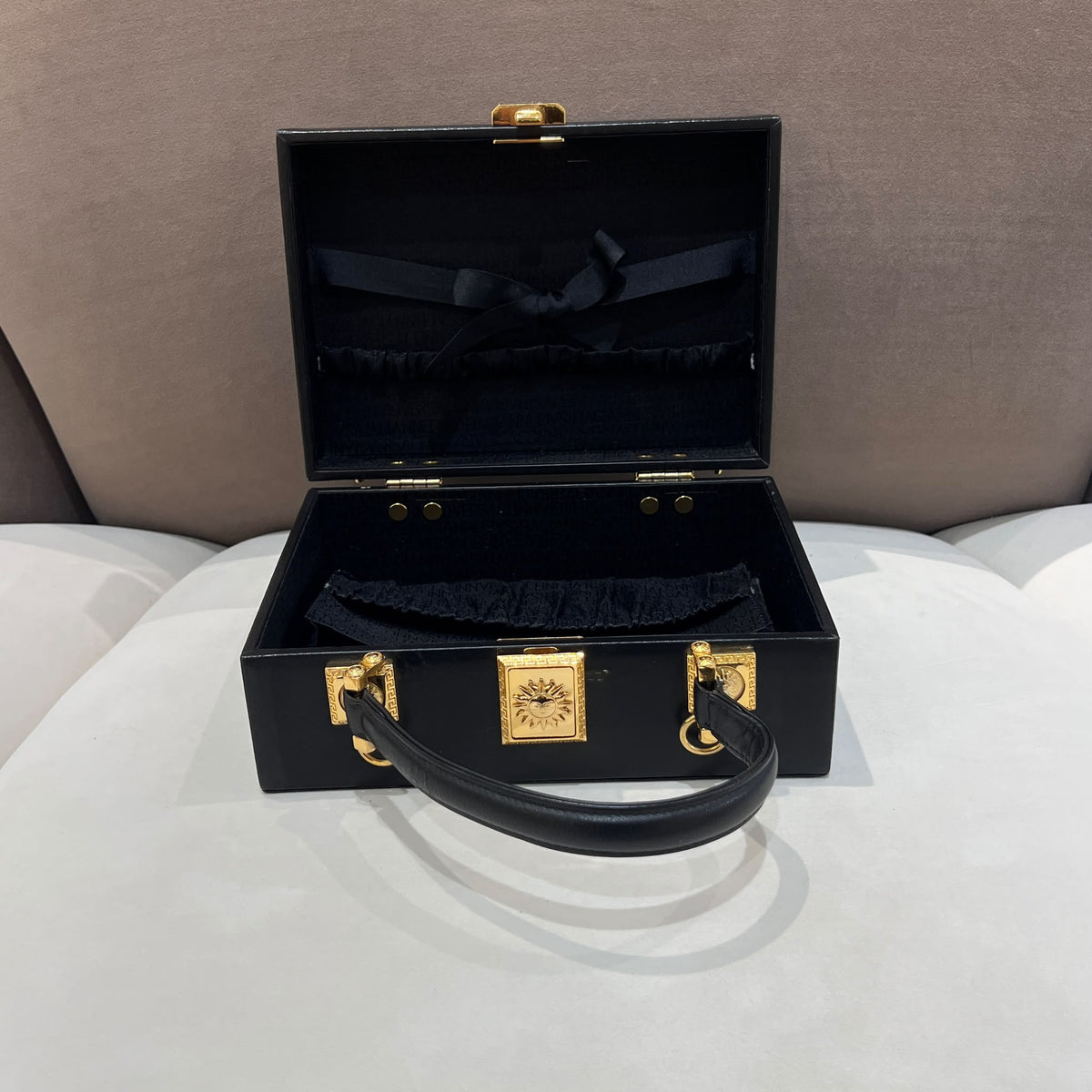 Versace Black Vanity Box Handbag with Gold-Tone Sunburst — open case front