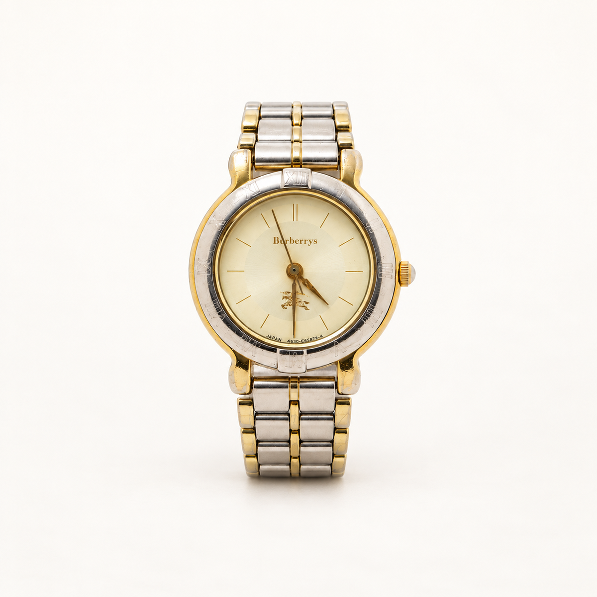 Front view of a Burberry two-tone ladies quartz watch with champagne dial and silver- and gold-tone bracelet
