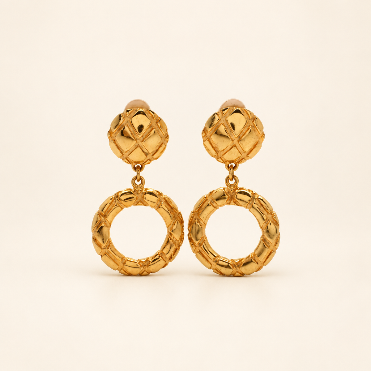 Celine Gold-Tone Knot Ring Drop Clip-On Earrings — front view on an ivory background