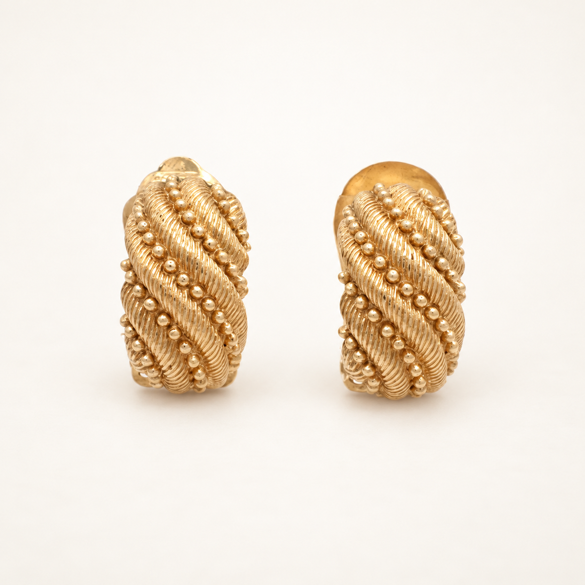 Christian Dior Gold-Plated Textured Rectangular Clip-On Earrings — front view on an ivory background