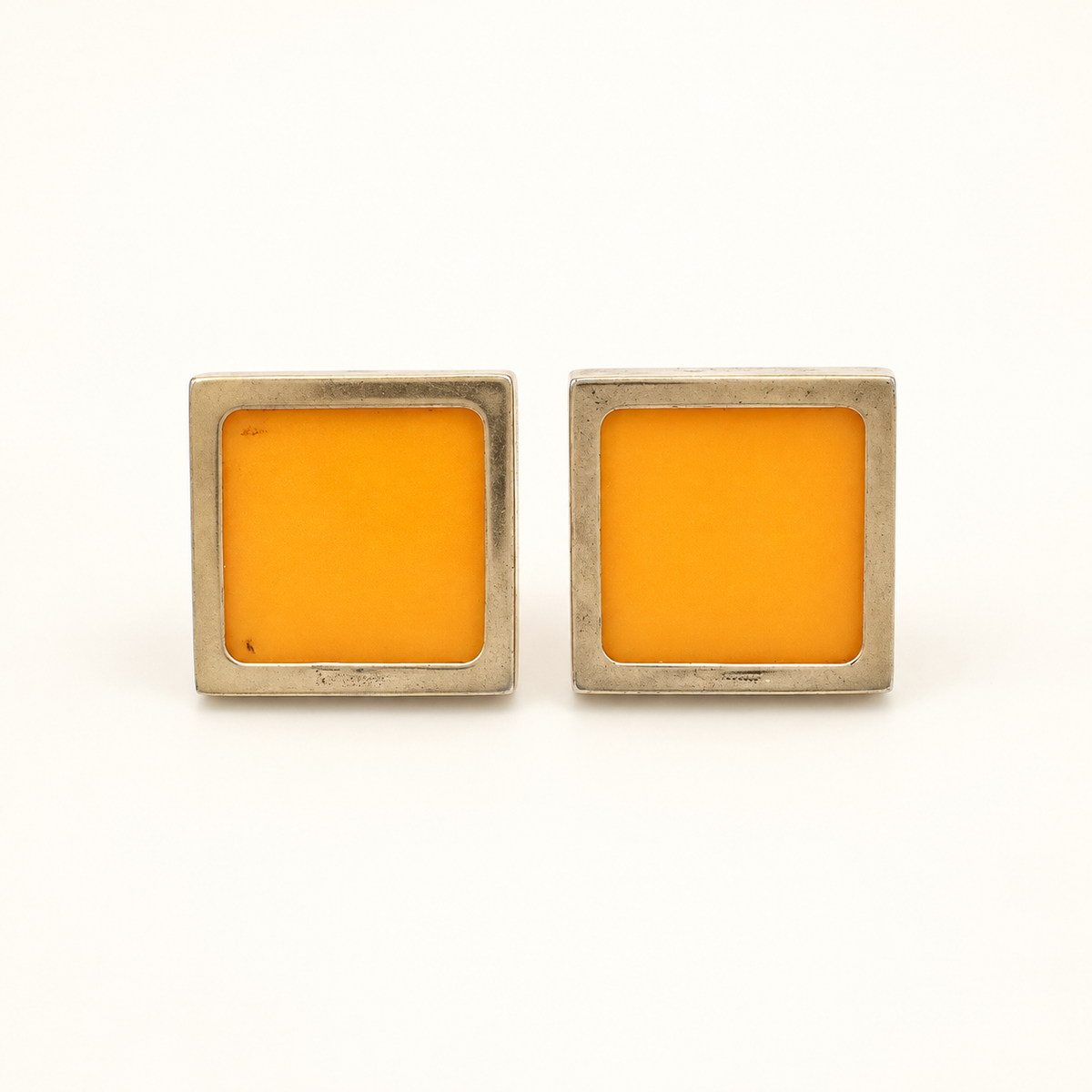 Ferragamo Orange Square Clip-On Earrings — front view on an ivory background