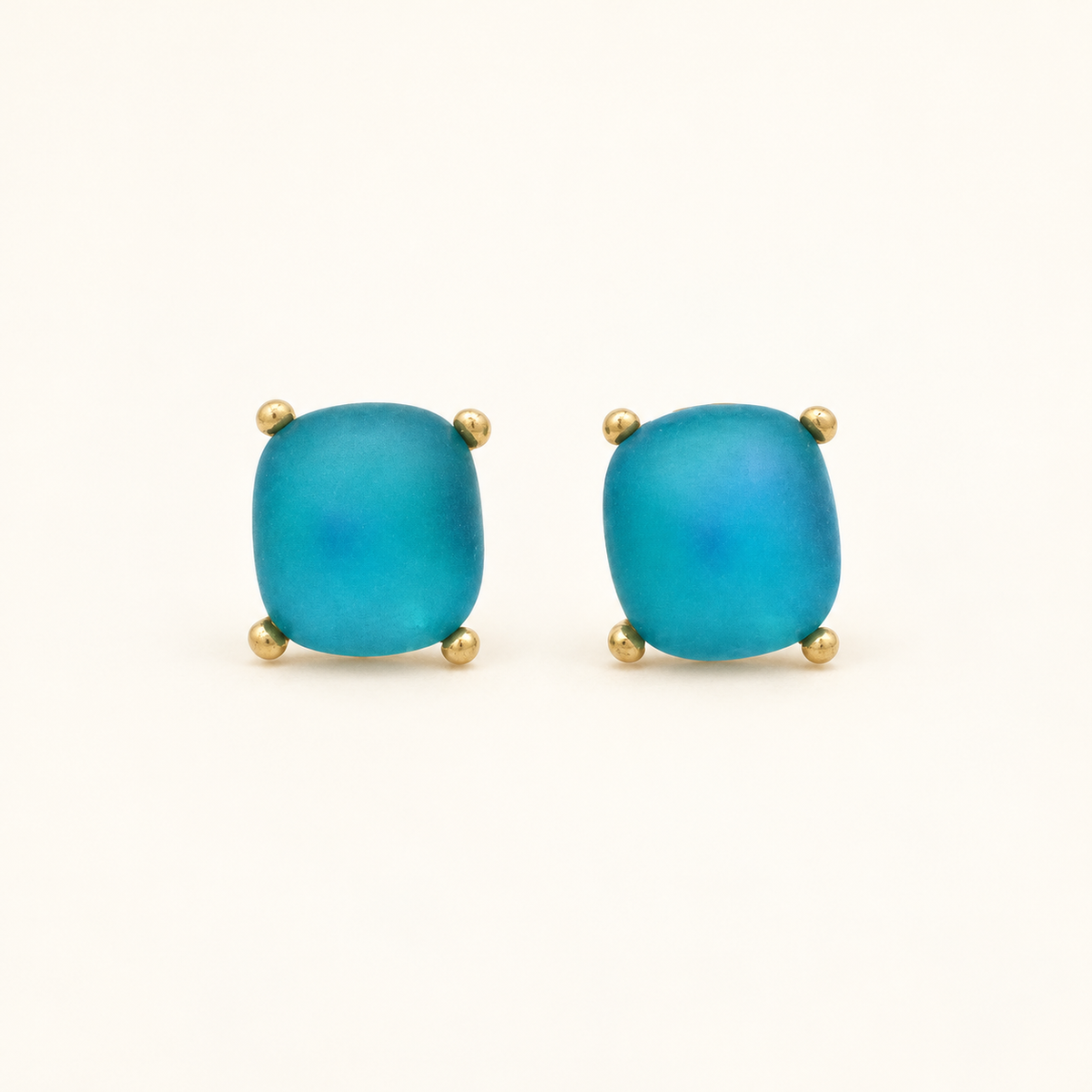 Givenchy Gold-Tone Turquoise-Blue Stone Clip-On Earrings — front view on an ivory background