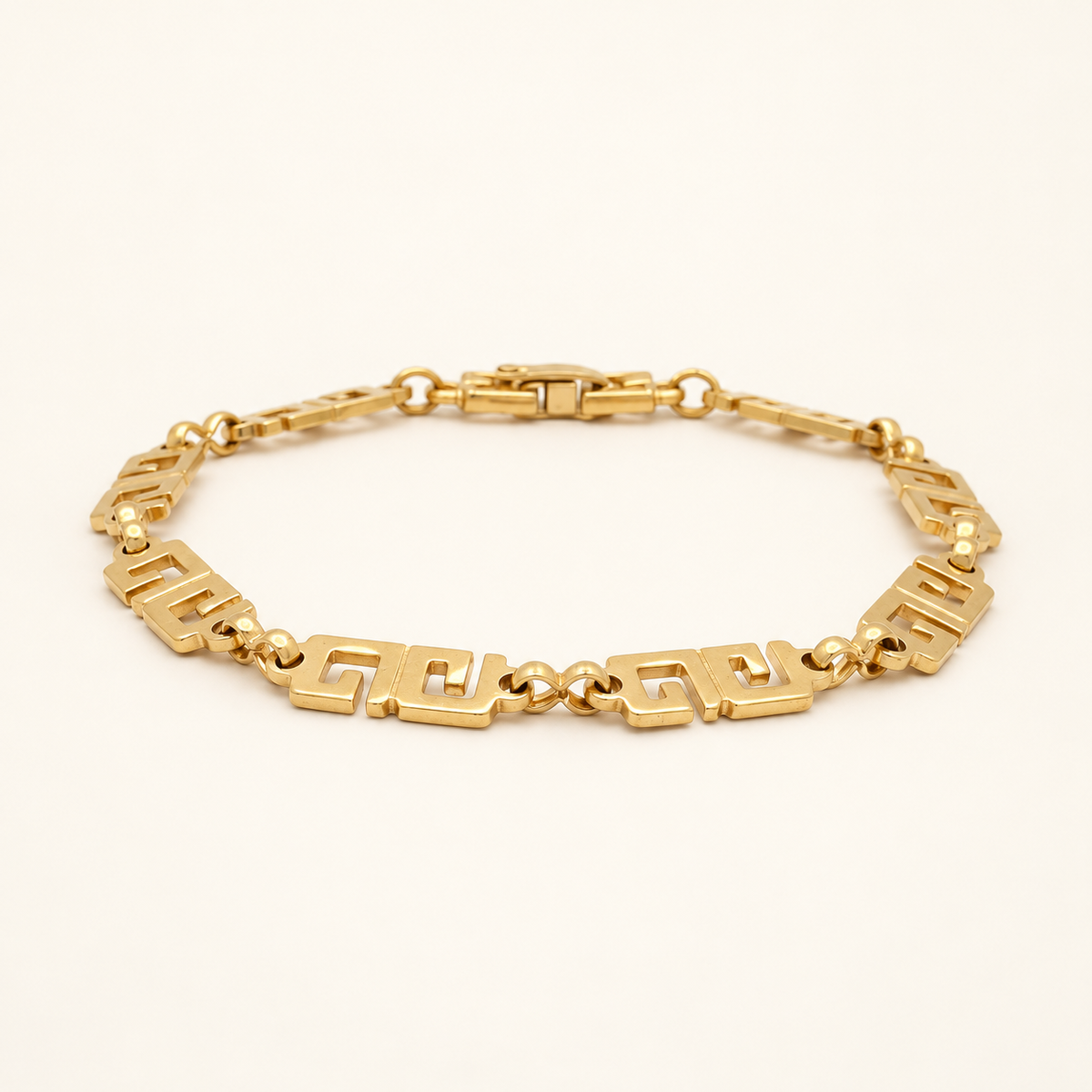 Givenchy Gold-Tone 4G Link Bracelet, 18cm — front view on an ivory background