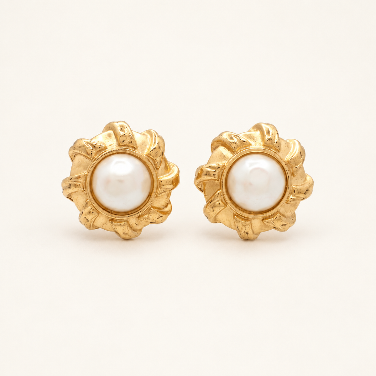 Givenchy Gold-Tone Faux Pearl Floral Clip-On Earrings — front view on an ivory background