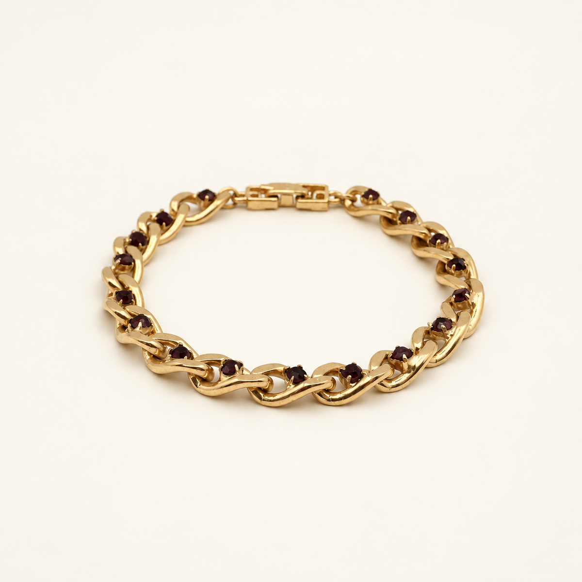Givenchy Gold-Tone Open Curb Link Bracelet — front view on an ivory background