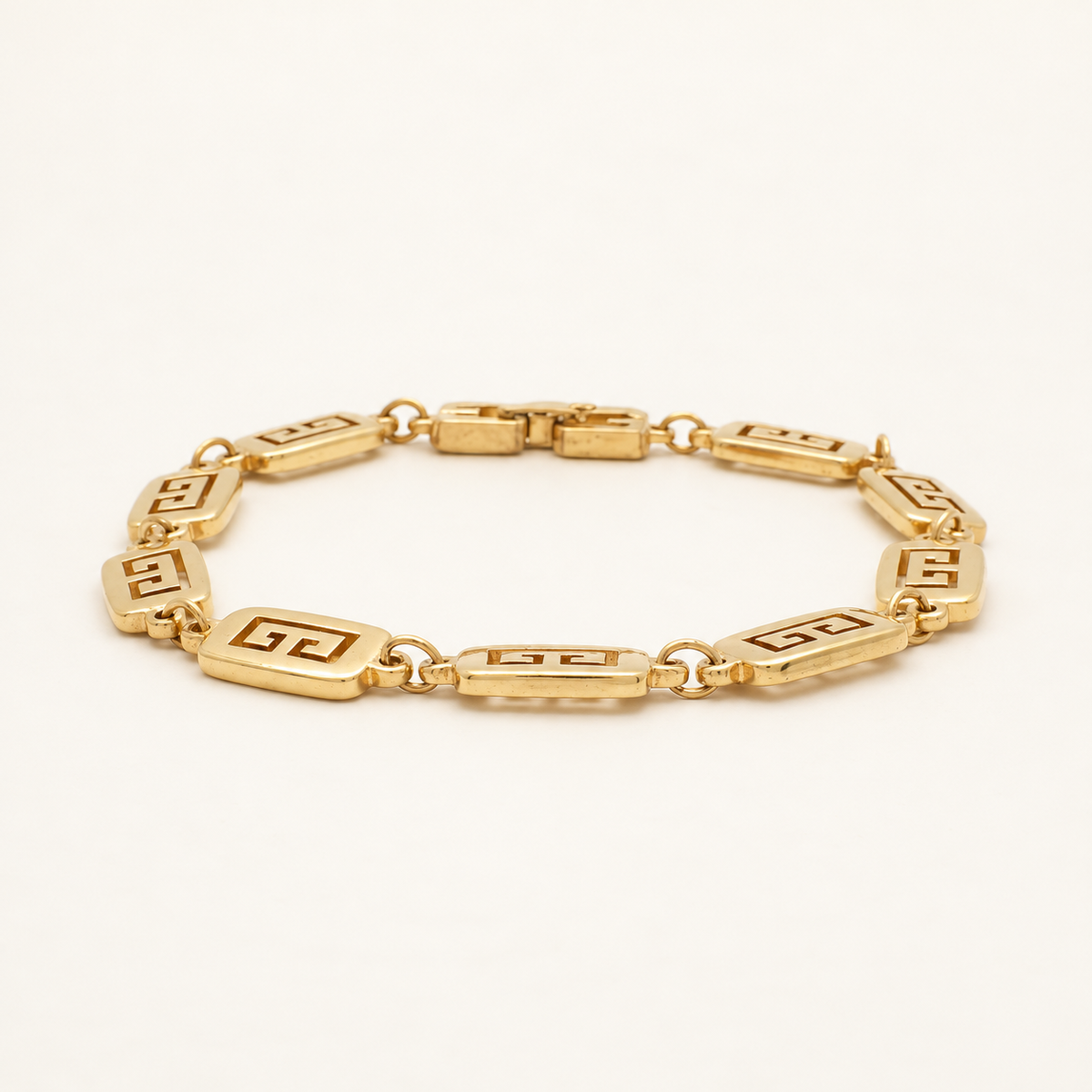 Givenchy Gold-Tone Long Logo Link Bracelet, 21cm — front view on an ivory background