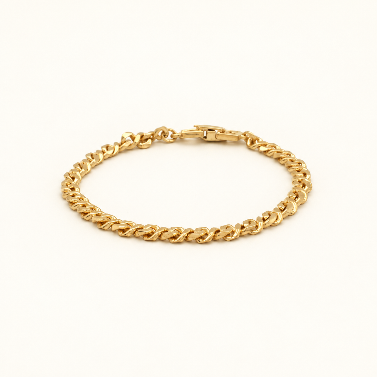 Givenchy Gold-Tone Fine Curb Chain Bracelet — front view on an ivory background