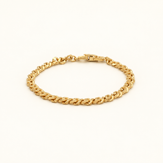 Givenchy Gold-Tone Fine Curb Chain Bracelet — front view on an ivory background
