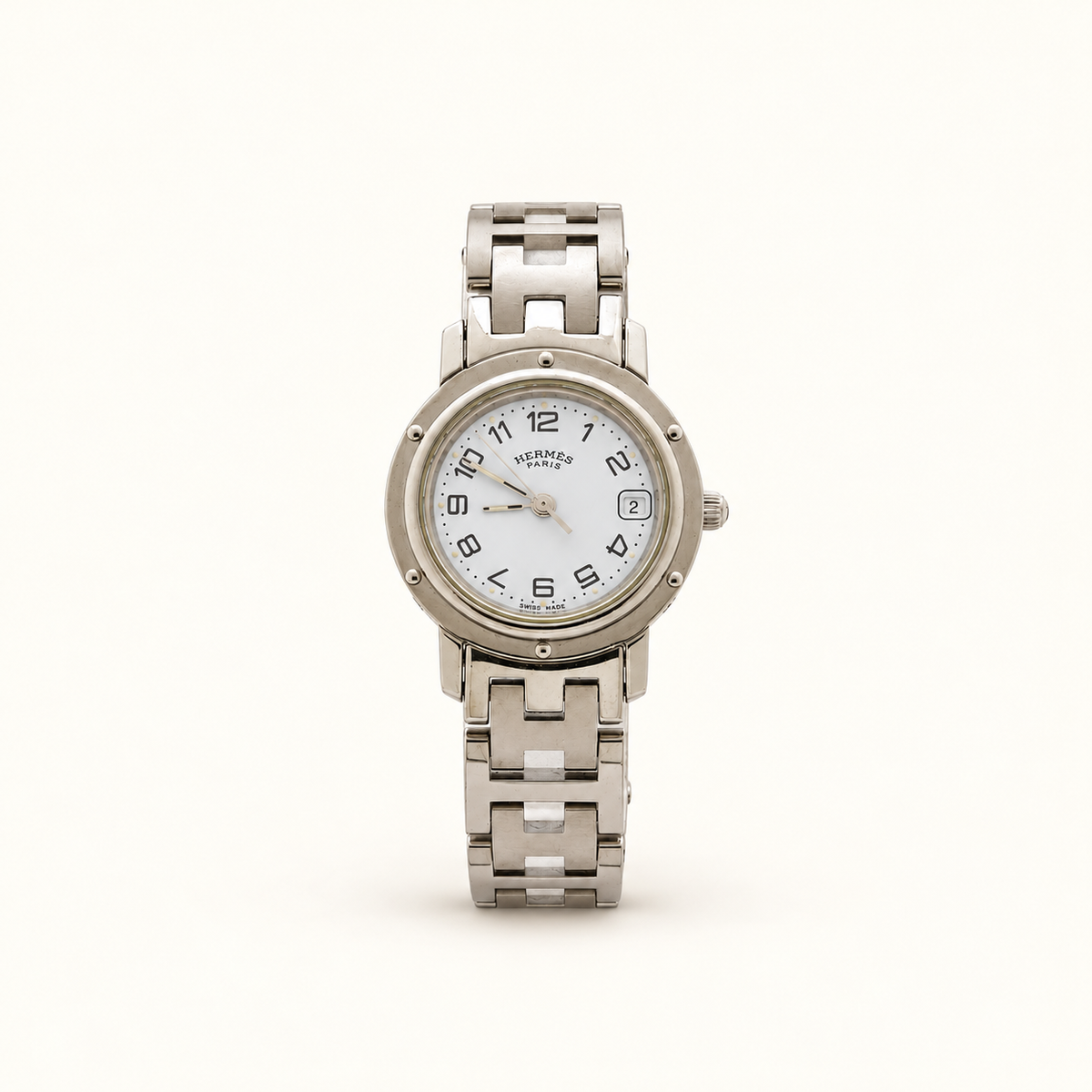Hermès Clipper White Dial Silver-Tone Quartz Ladies Watch — front view on an ivory background
