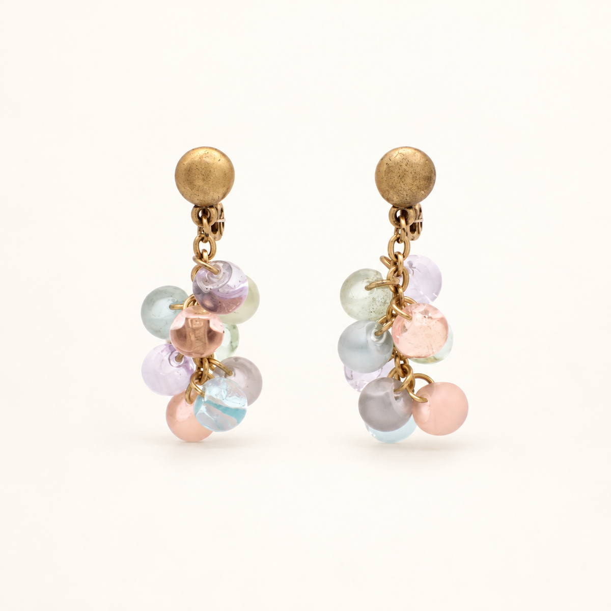 Yves Saint Laurent Pastel Bead Drop Clip-On Earrings — front view on an ivory background