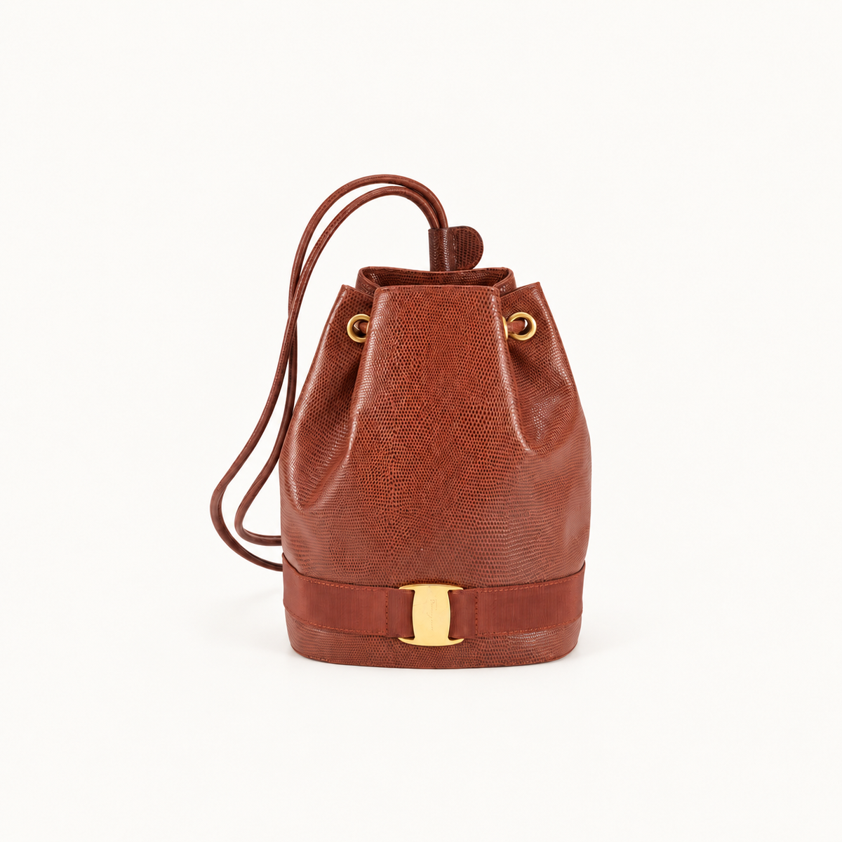 Front view of a brown Ferragamo Gancini textured bucket shoulder bag with drawstring straps and gold-tone hardware