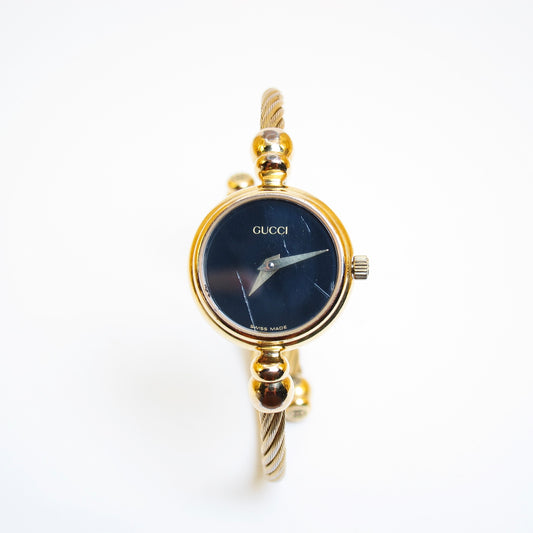 Gucci Vintage Round Black Face Golden Bangle Watch