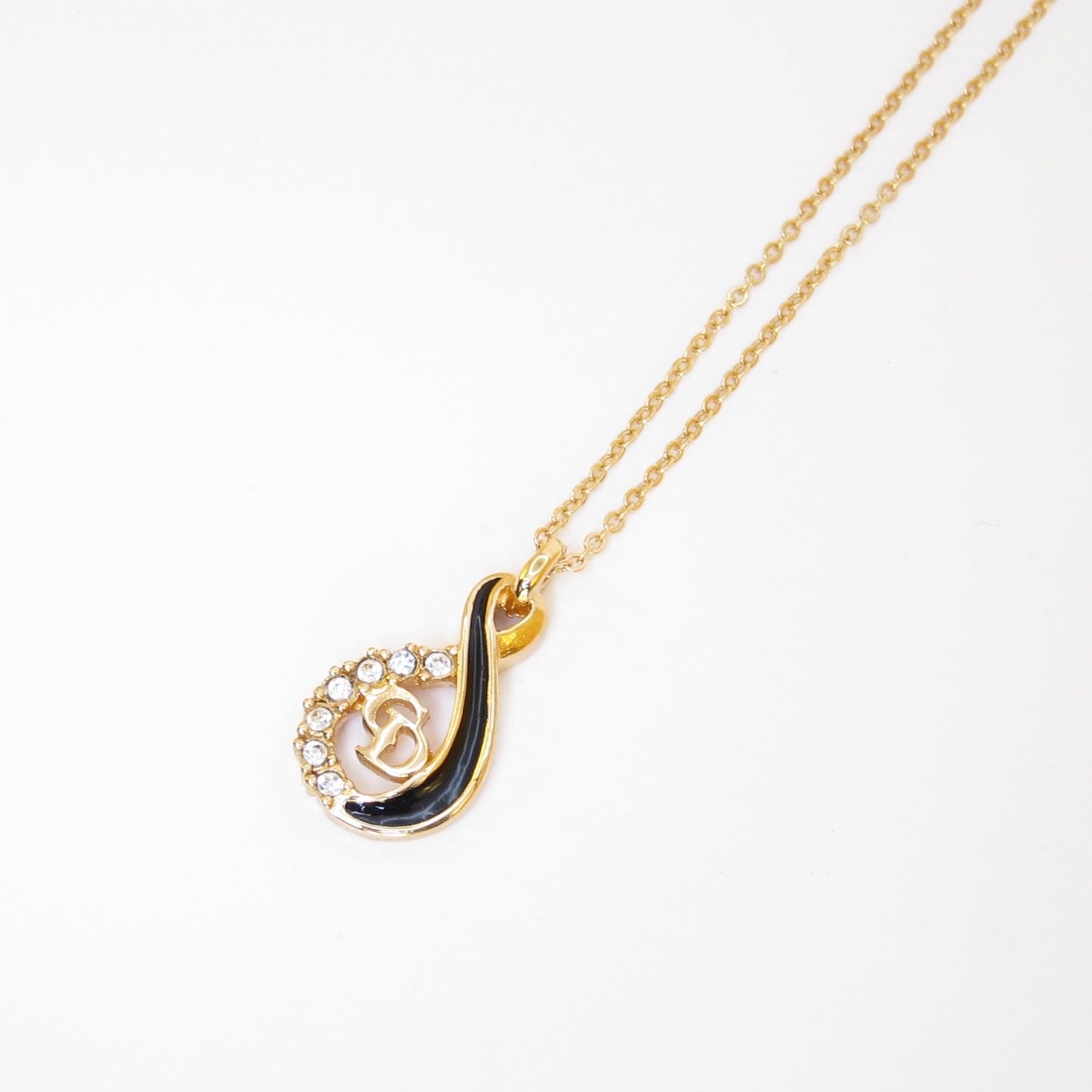 Christian Dior Vintage CD Logo Black and Rhinestone Twist Pendant Golden Necklace