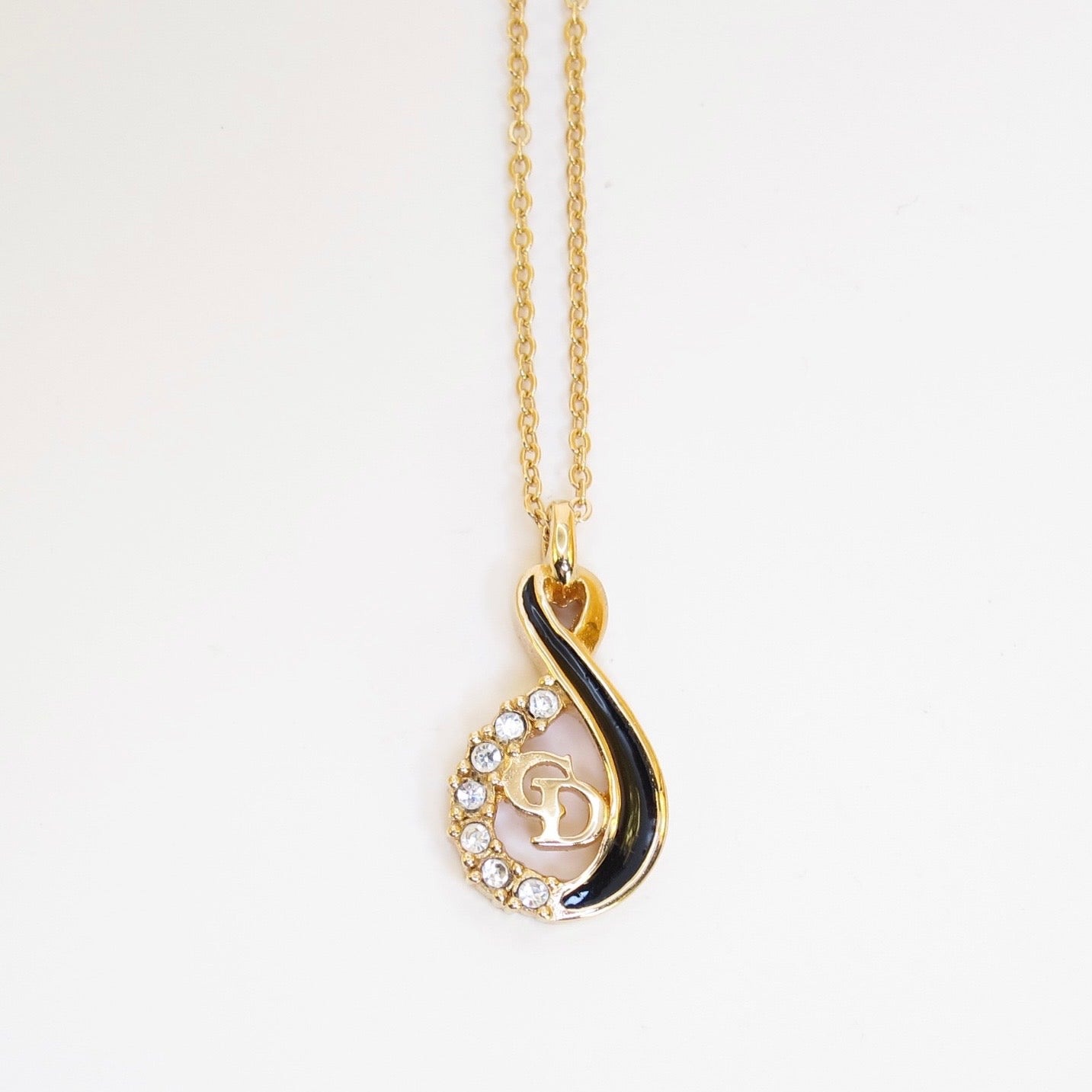 Christian Dior Vintage CD Logo Black and Rhinestone Twist Pendant Golden Necklace