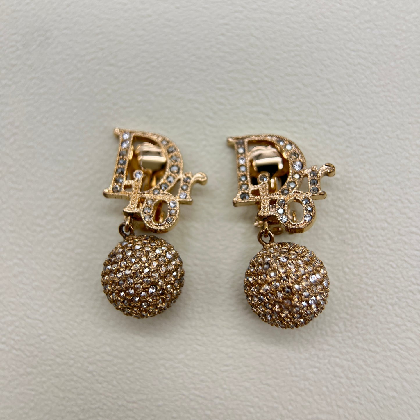 Christian Dior Vintage Dior Logo and Ball Dangling with Rhinestone Golden Clip-on Earrings