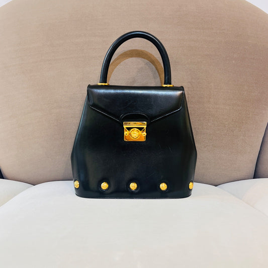 Ferragamo Vintage Black Leather 2-Way Handbag With Gold Medallions