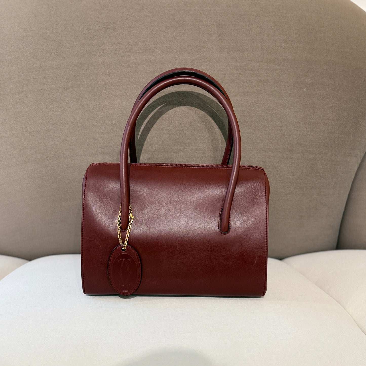 Cartier Must Line Burgundy Red Leather Boston Bag With Golden Chain Logo Charm