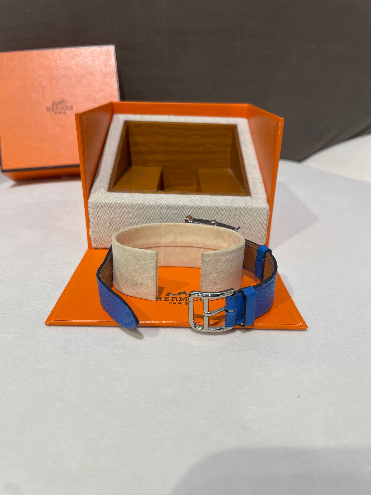 Hermes Vintage Blue Face Stainless Steel H Watch With Blue Leather Strap
Product Of 1997
With Original Box