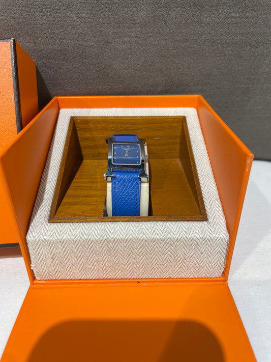 Hermes Vintage Blue Face Stainless Steel H Watch With Blue Leather Strap
Product Of 1997
With Original Box