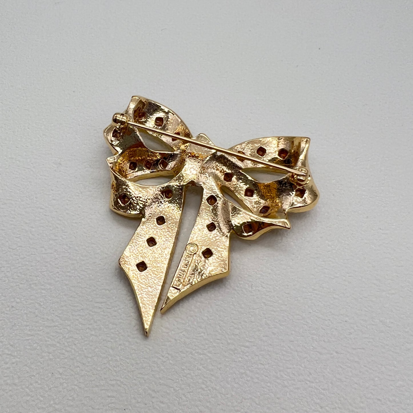 Nina Ricci Vintage Ribbon Motif with Multi Color Stone Golden Brooch