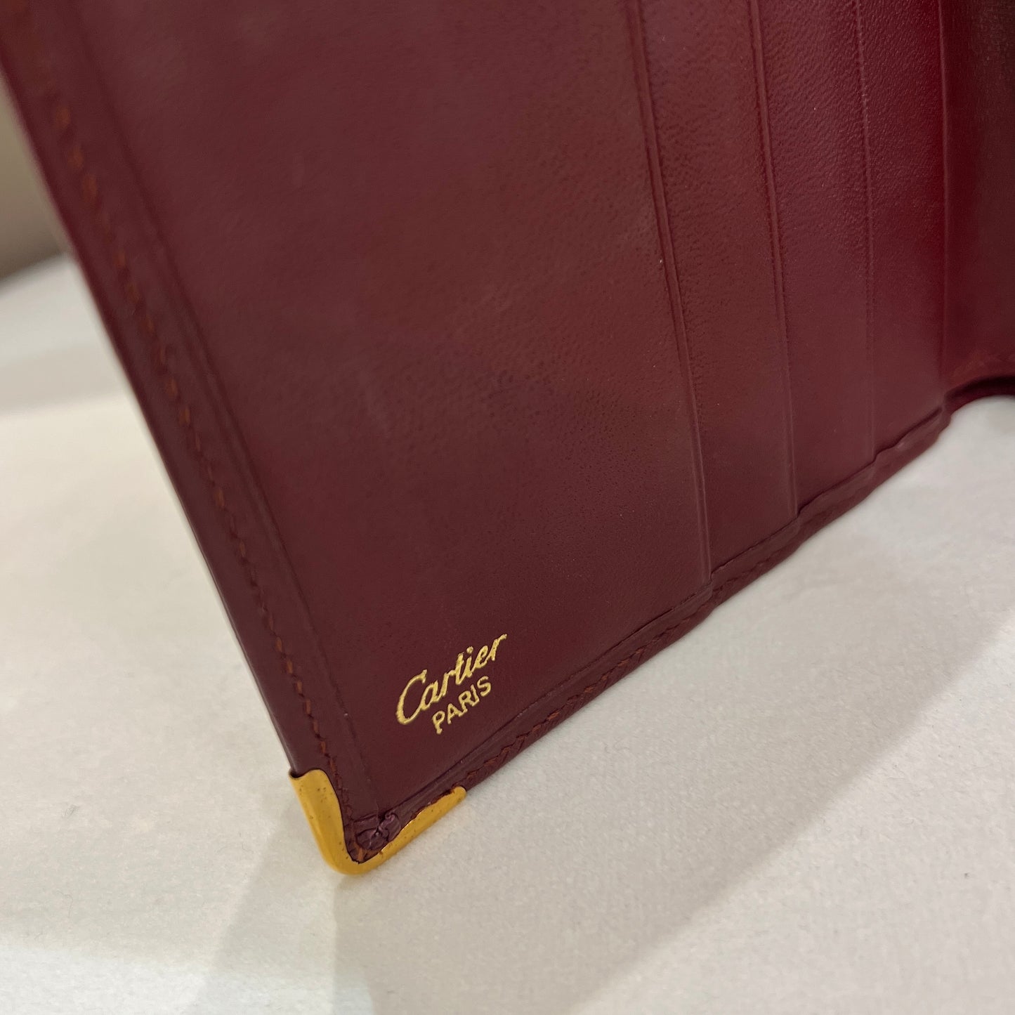 Cartier 復古酒紅色小牛皮 Must De 雙折錢包