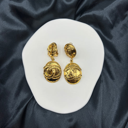 Chanel Cc Logo Oval Dangling Large Pandent Golden Clip-On Earrings
Product Of 1994
With Original Box